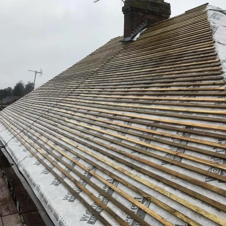 the roof of a house is covered in snow