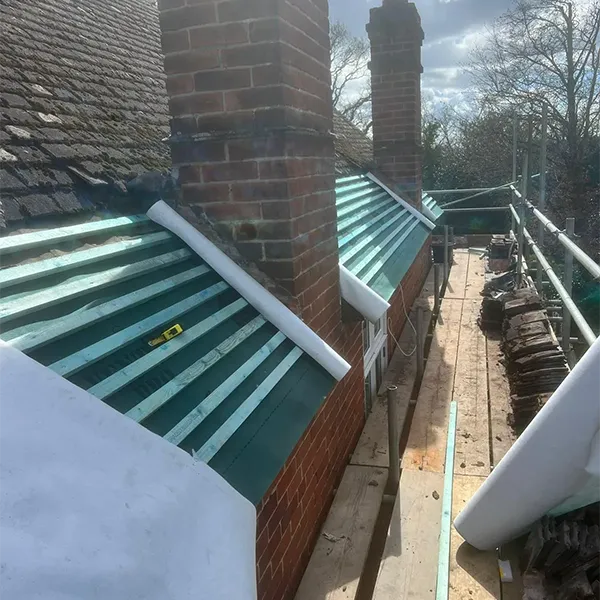 A view of a roof with a surfboard on top of it.