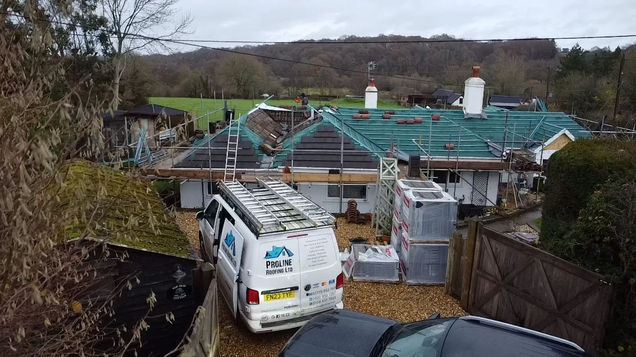 A white van parked in front of a house.